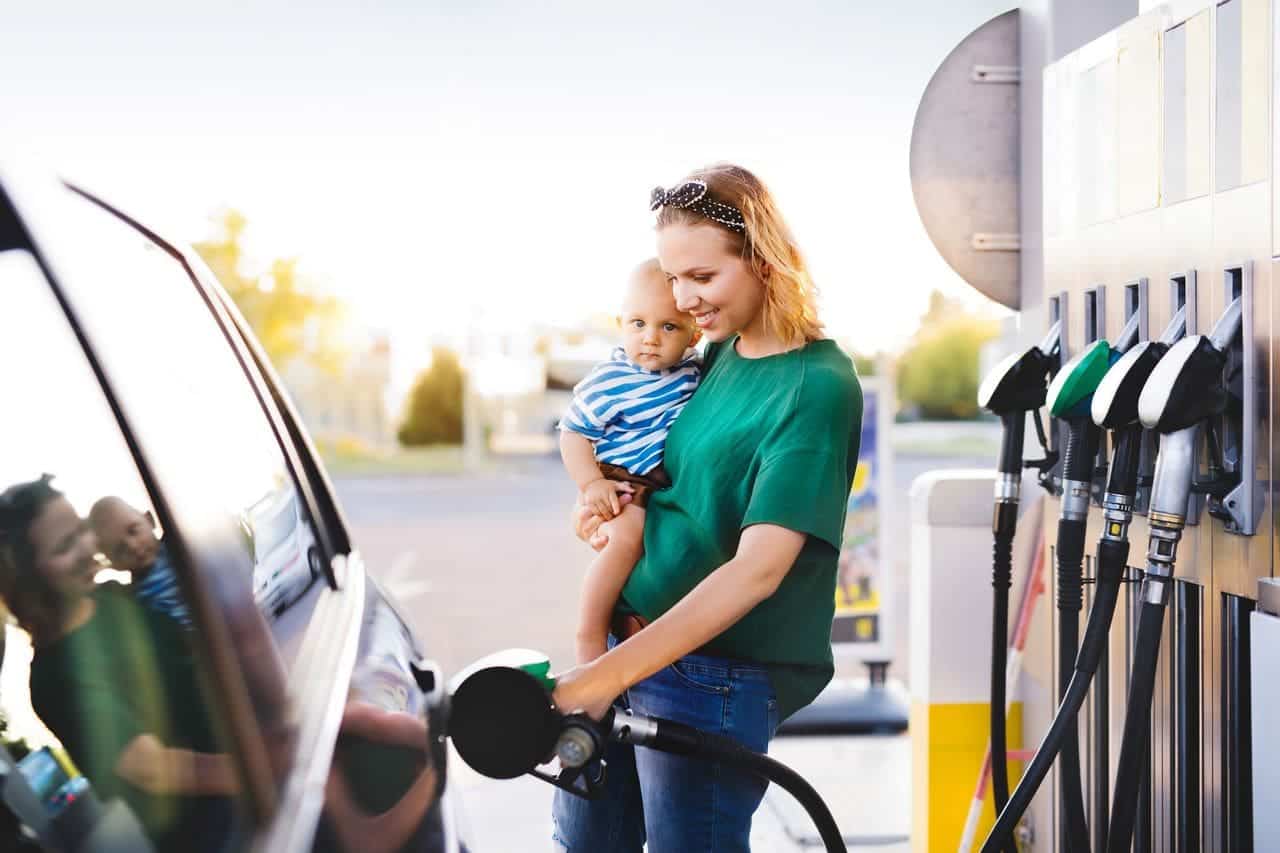 parent fuelling car with redkites financial assistance program offering financial help for cancer patients and their families